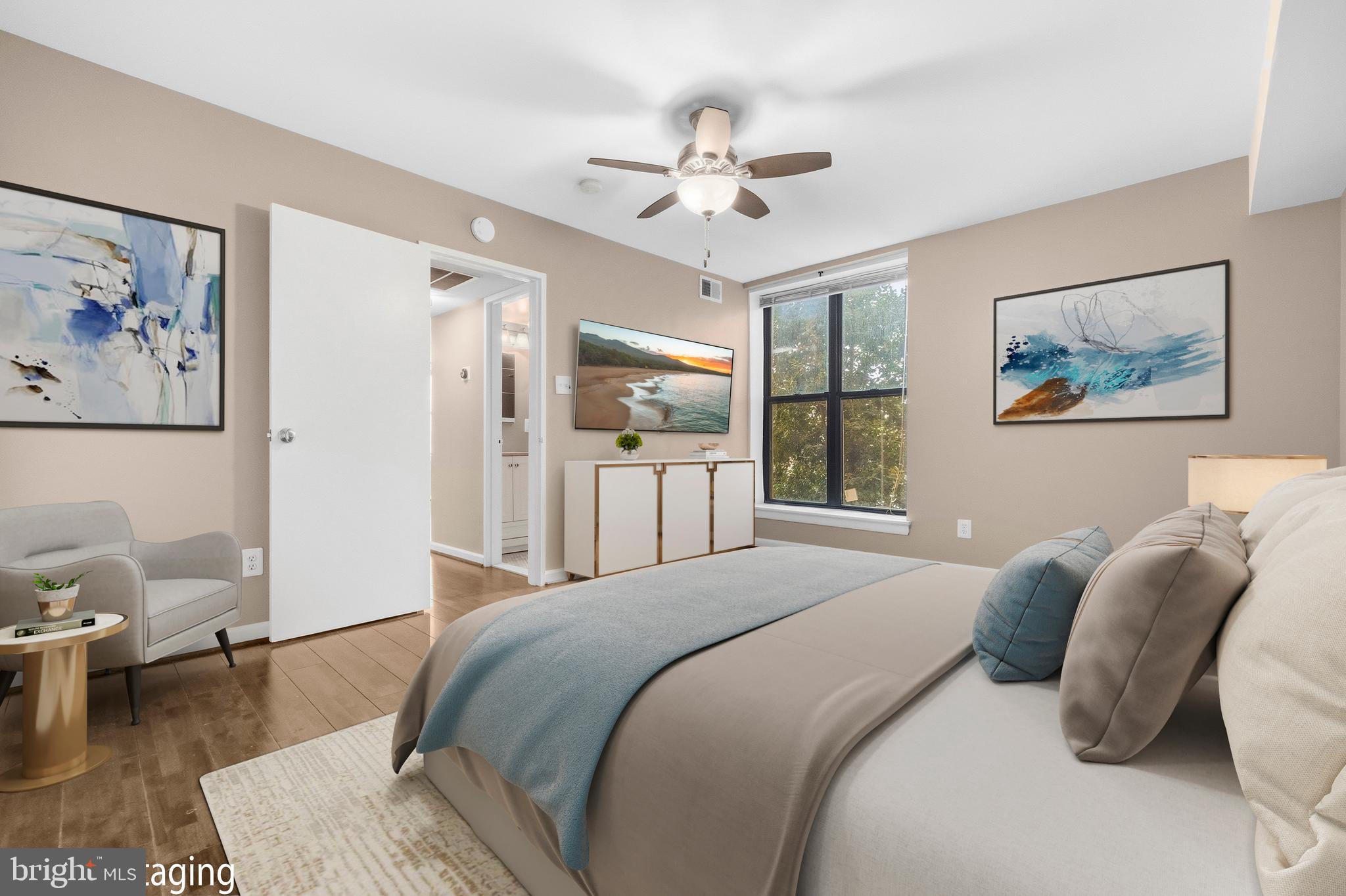 3902 14th Street Northwest, Unit 321 Washington, DC 20011 - Photo 15 of 21 a bedroom with a large bed and a chandelier