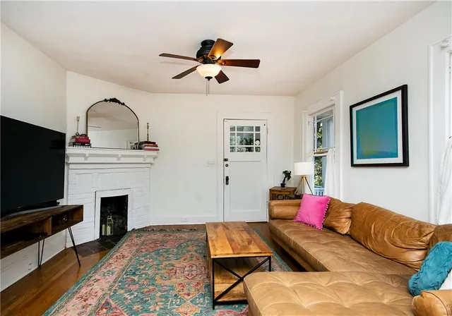a living room with furniture and a rug