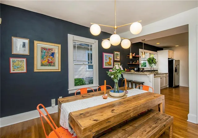 a kitchen with stainless steel appliances granite countertop a sink a stove and a refrigerator