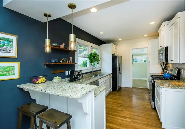 a kitchen with sink and window