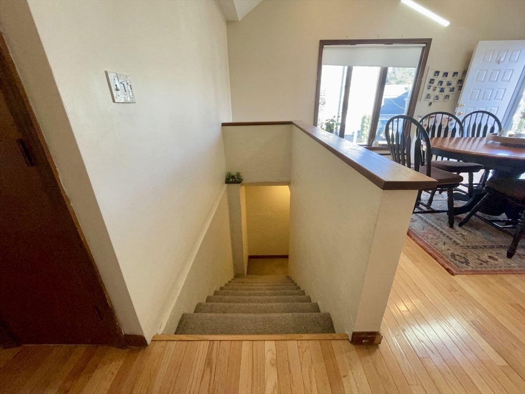 15 Burghardt Street, Unit B Worcester, MA 01604 - Photo 12 of 30 a view of entryway and hall with wooden floor