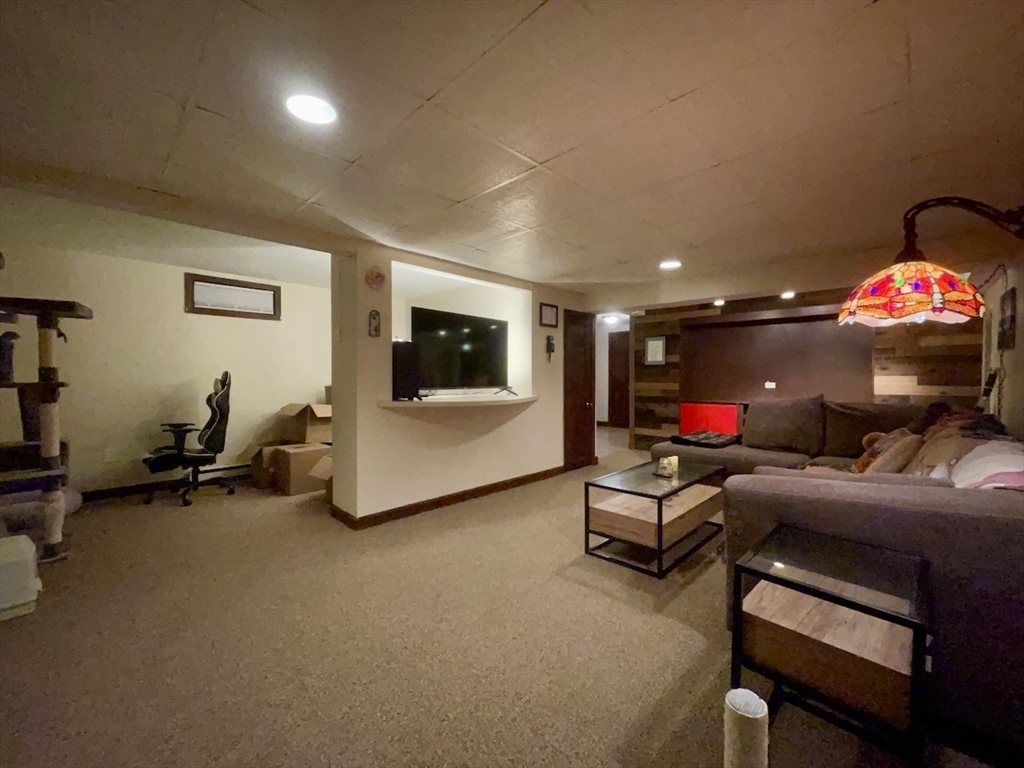 15 Burghardt Street, Unit B Worcester, MA 01604 - Photo 19 of 30 a living room with furniture and a flat screen tv