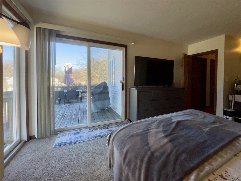 15 Burghardt Street, Unit B Worcester, MA 01604 - Photo 21 of 30 a bedroom with a bed and a television