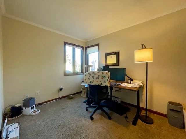 a workspace with furniture and a window