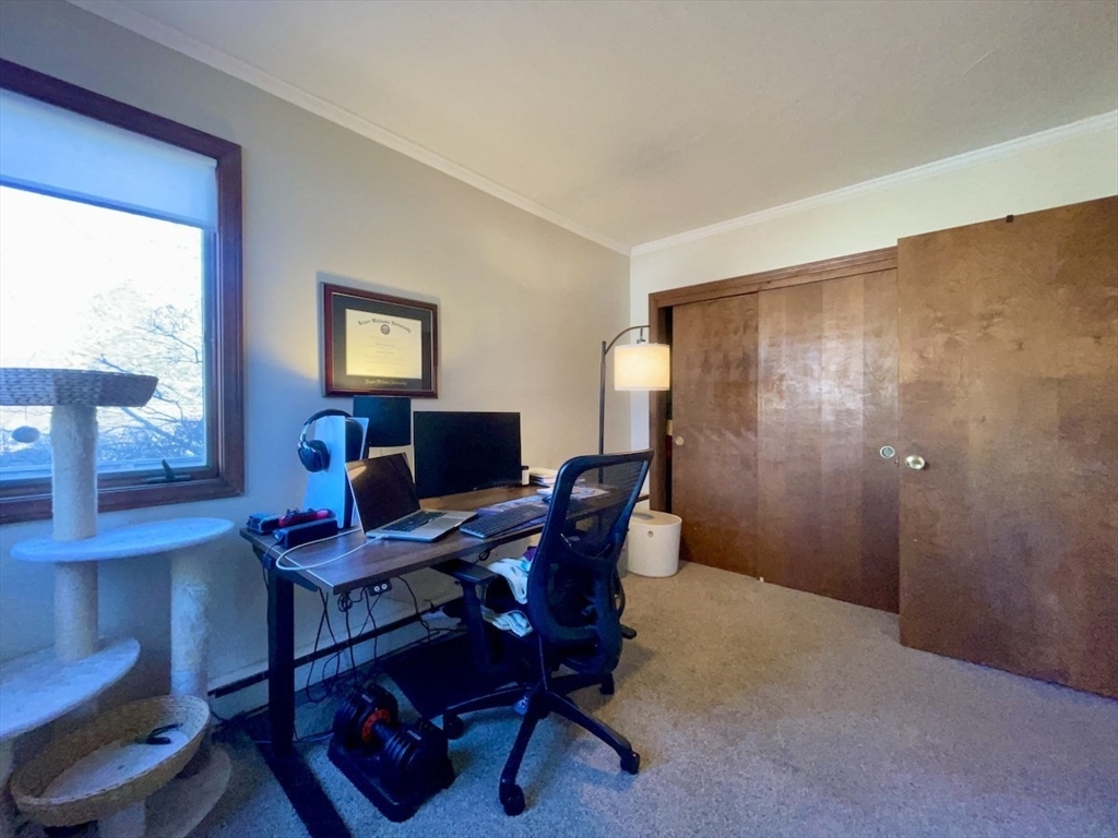 15 Burghardt Street, Unit B Worcester, MA 01604 - Photo 25 of 30 a work room with furniture and a window
