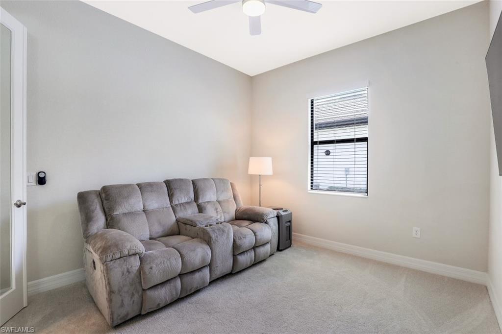 2134 Antigua Lane Naples, FL 34120 - Photo 18 of 31 a living room with furniture and a window
