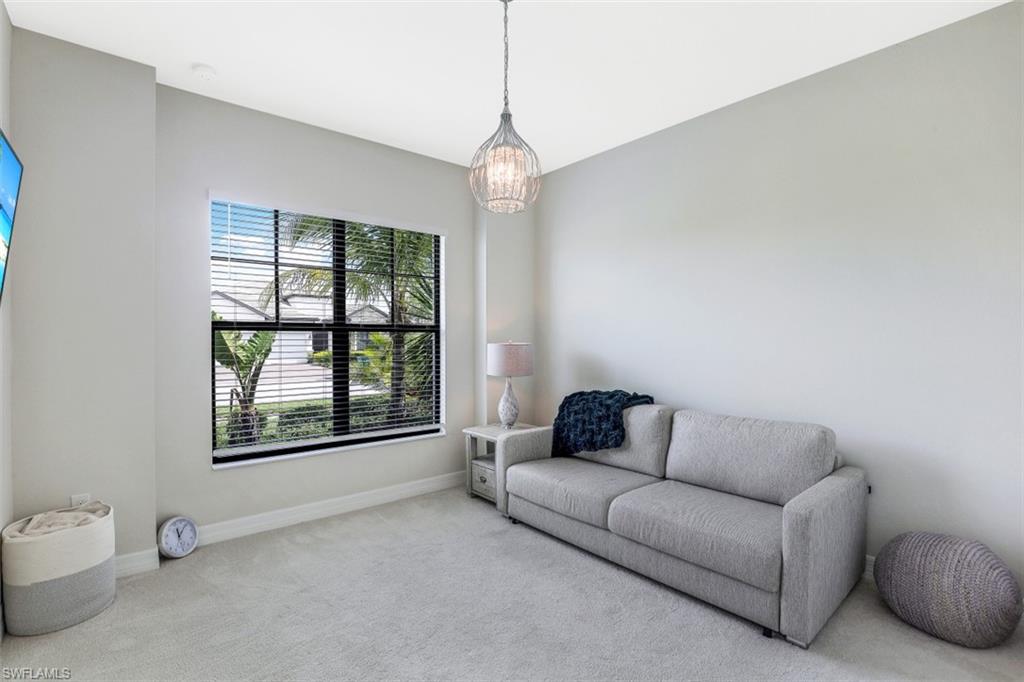 2134 Antigua Lane Naples, FL 34120 - Photo 20 of 31 a living room with furniture and a window