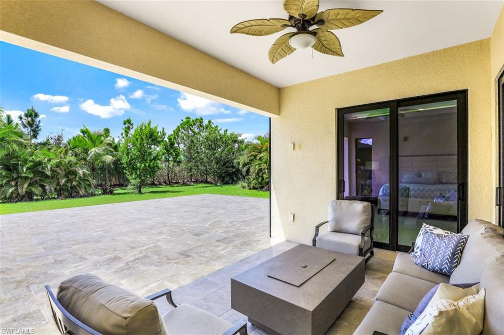 2134 Antigua Lane Naples, FL 34120 - Photo 21 of 31 a living room with furniture and a large window