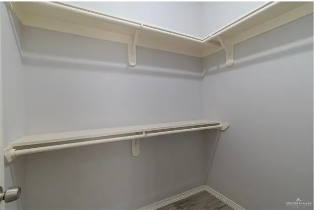 a view of a room with racks on the wall