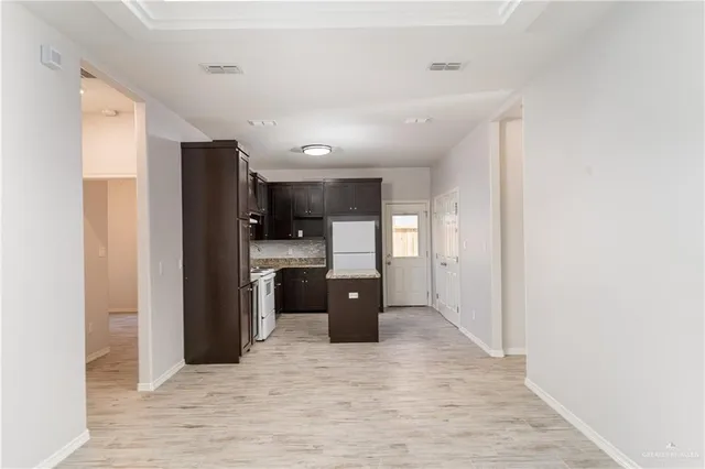 a kitchen with stainless steel appliances a refrigerator and a sink