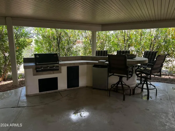 a open kitchen with dining table and chairs