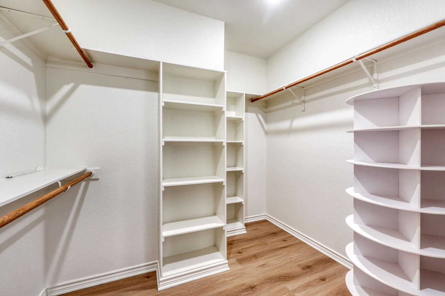 1642 Scull Road San Marcos, TX 78666 - Photo 18 of 31 Large primary closet with extensive shelving and hanging space.
