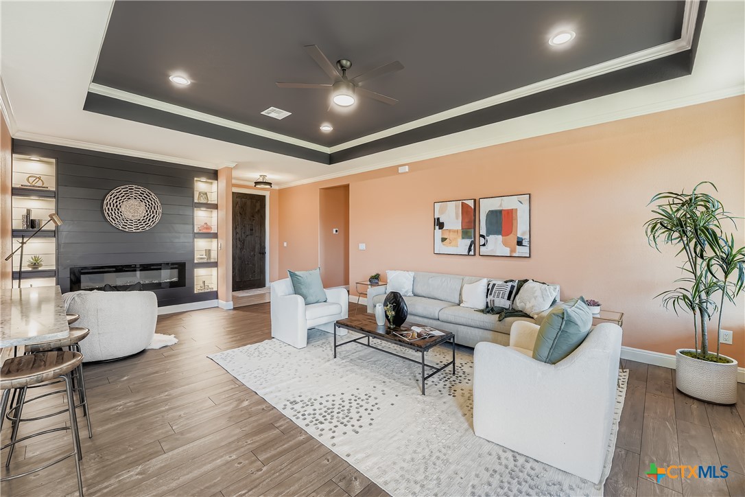 222 Arosa Drive Elgin, TX 78621 - Photo 17 of 40 a living room with furniture and wooden floor