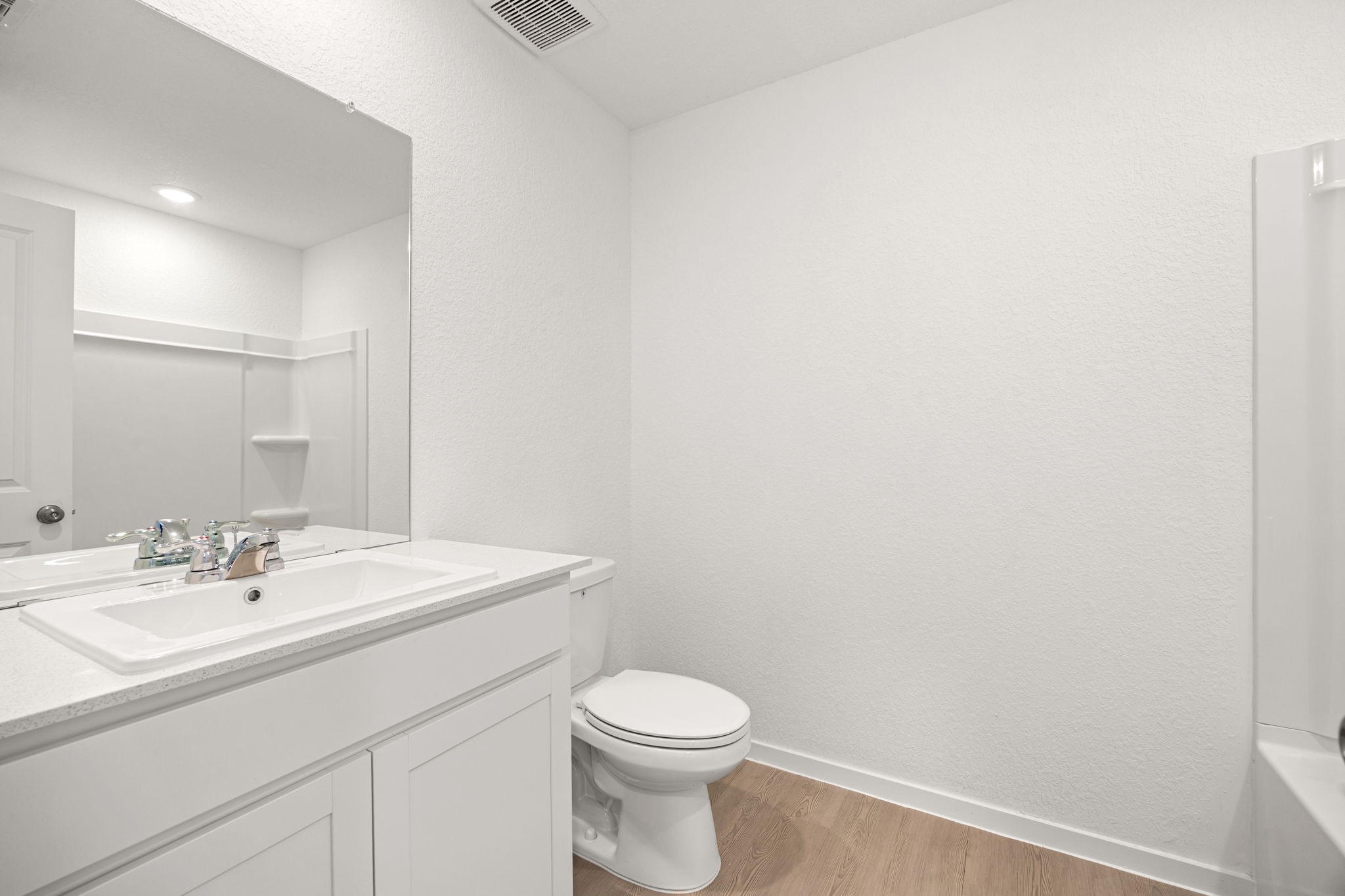 31433 Moore Road Magnolia, TX 77354 - Photo 14 of 25 a bathroom with a sink a toilet and mirror