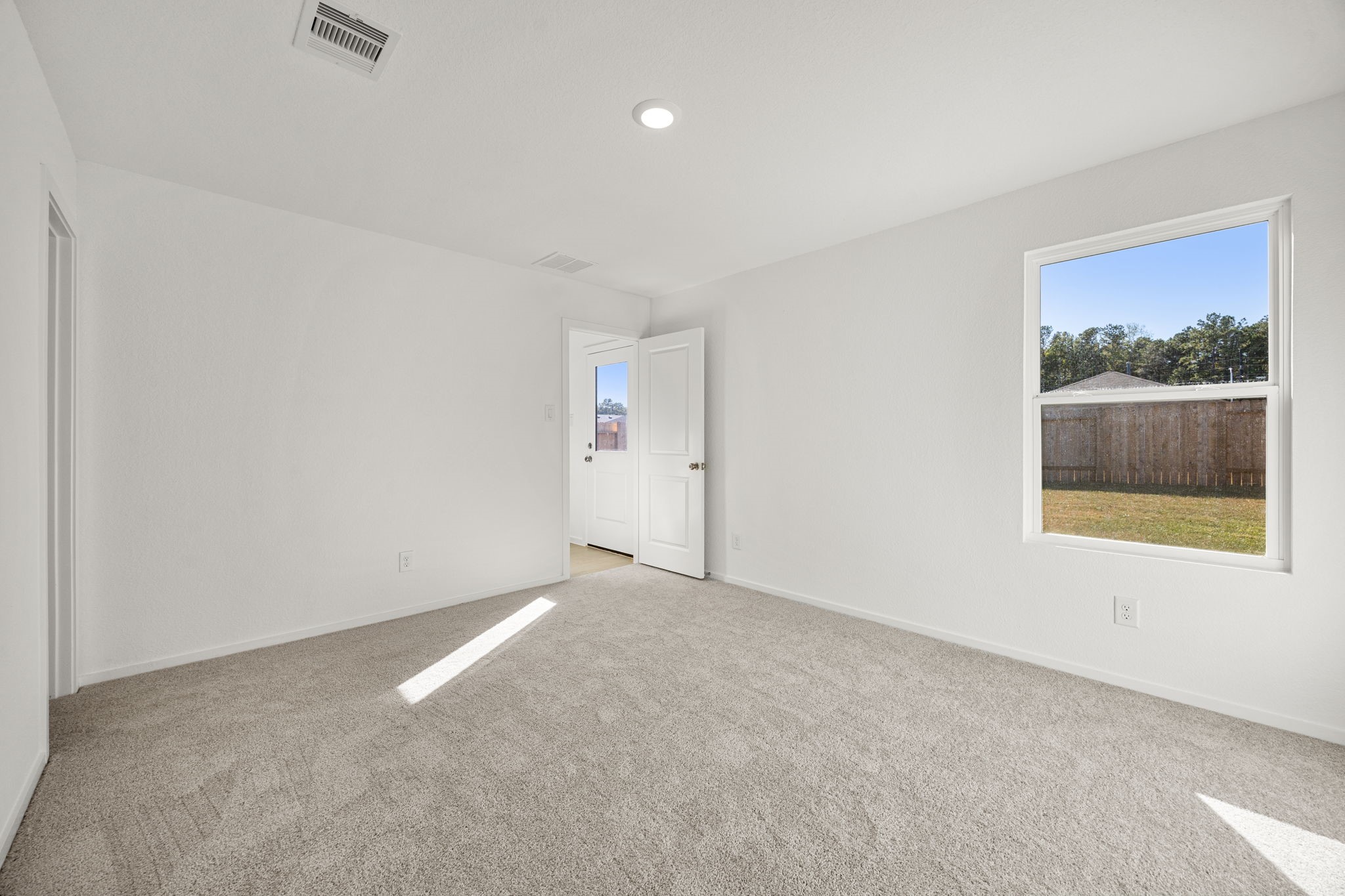 31433 Moore Road Magnolia, TX 77354 - Photo 19 of 25 an empty room with a window