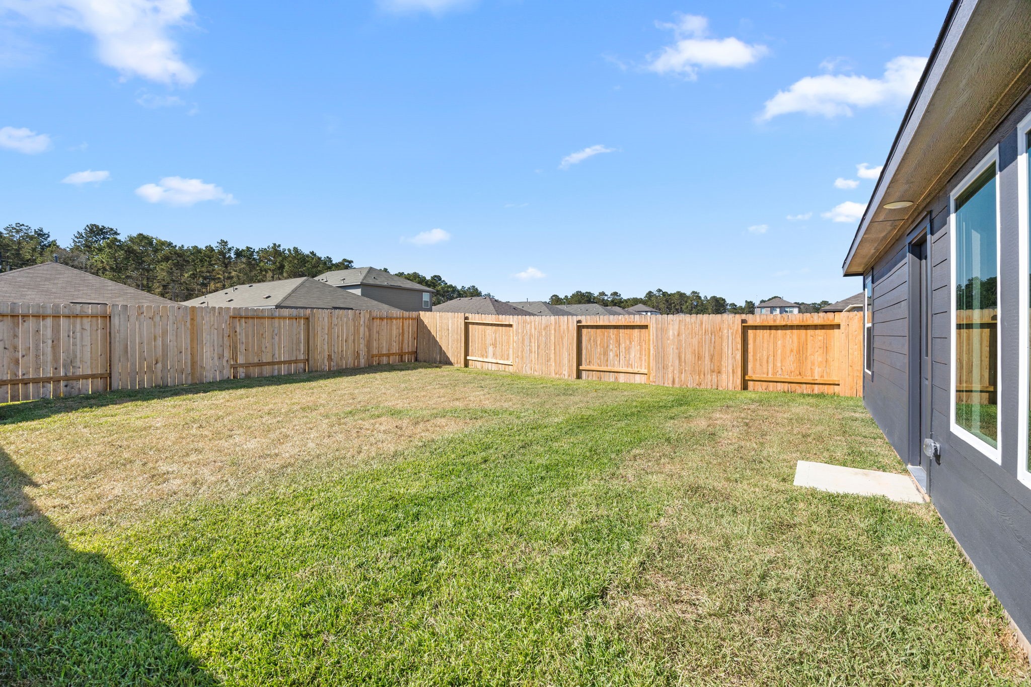 31433 Moore Road Magnolia, TX 77354 - Photo 24 of 25 a swimming pool with an outdoor seating and house