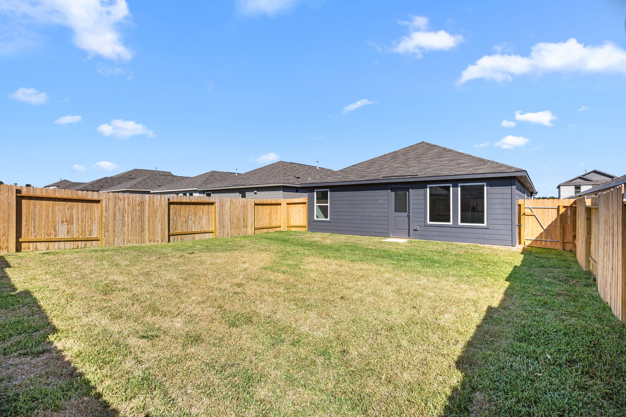 31433 Moore Road Magnolia, TX 77354 - Photo 25 of 25 a front view of a house with a yard