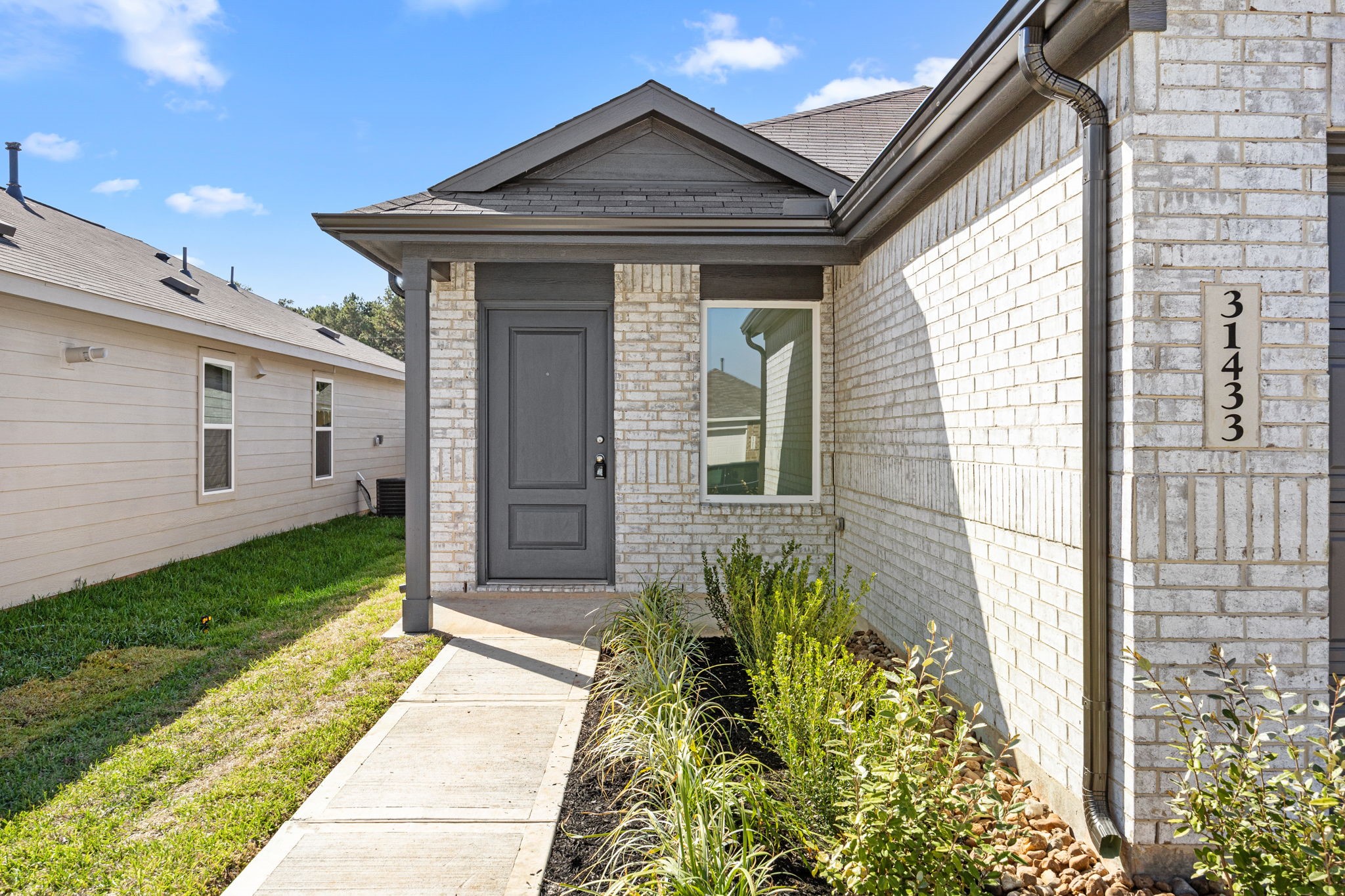 31433 Moore Road Magnolia, TX 77354 - Photo 3 of 25 a front view of a house with a yard