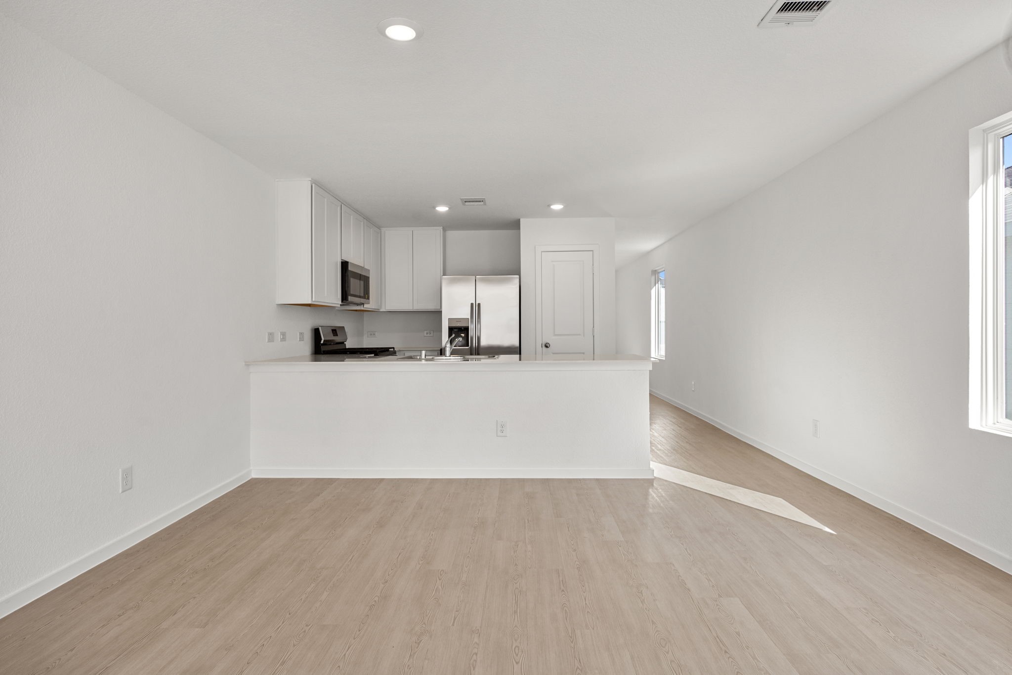 31433 Moore Road Magnolia, TX 77354 - Photo 4 of 25 a view of kitchen with refrigerator and window