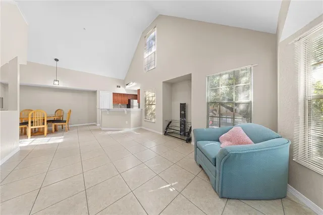 a kitchen with granite countertop a stove sink and microwave