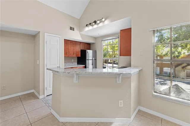 a white refrigerator freezer sitting in a kitchen