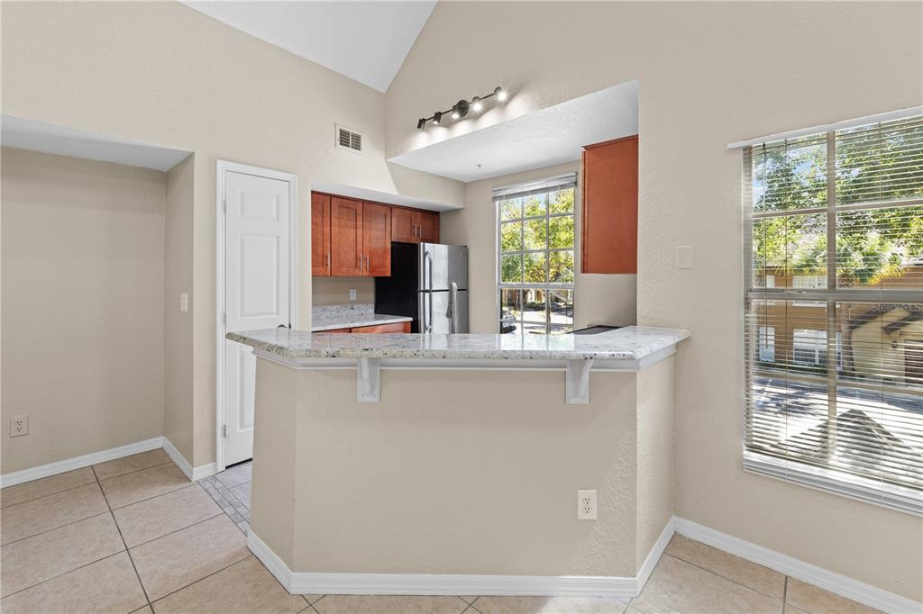 6340 Raleigh Street, Unit 1011 Orlando, FL 32835 - Photo 16 of 68 a bathroom with a sink and a mirror