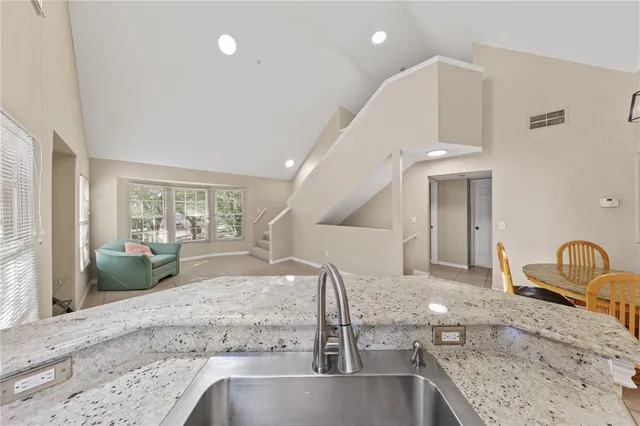a white bath tub sitting next to a shower