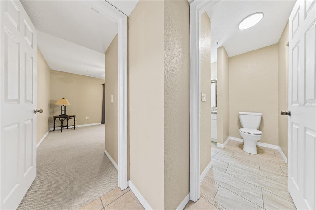 6340 Raleigh Street, Unit 1011 Orlando, FL 32835 - Photo 27 of 68 a view of a bathroom with a sink and a toilet