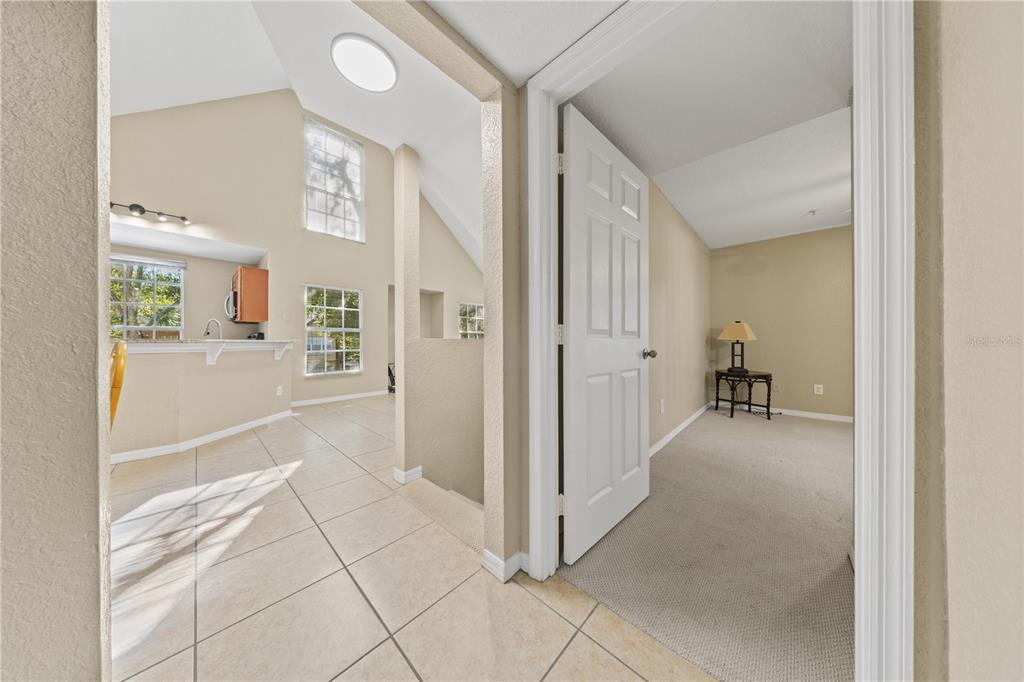 6340 Raleigh Street, Unit 1011 Orlando, FL 32835 - Photo 28 of 68 a view of a livingroom with wooden floor and a bathroom