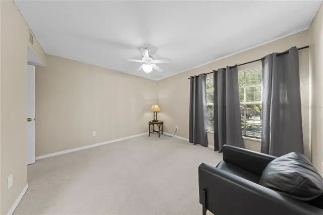 a view of living room with furniture and wooden floor