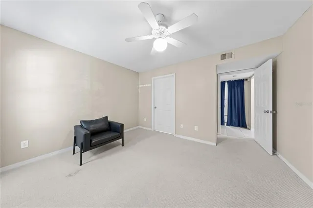 a patio with a table and chairs under an umbrella