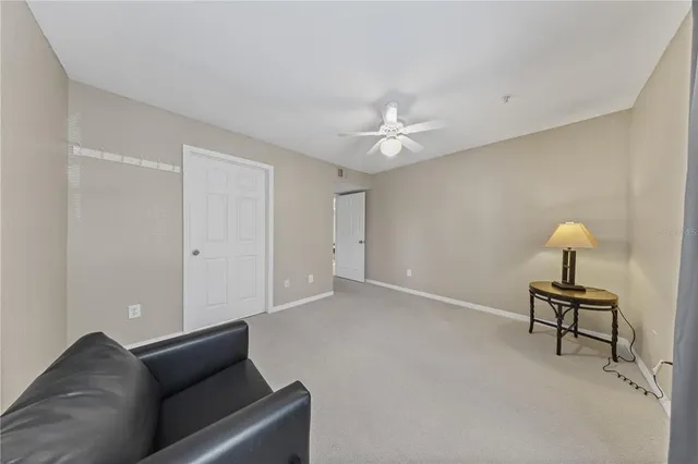 a front view of a house with garden and sitting area