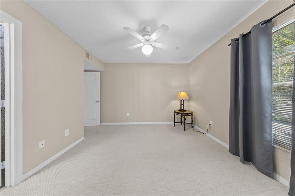 6340 Raleigh Street, Unit 1011 Orlando, FL 32835 - Photo 45 of 68 a workspace with furniture and window