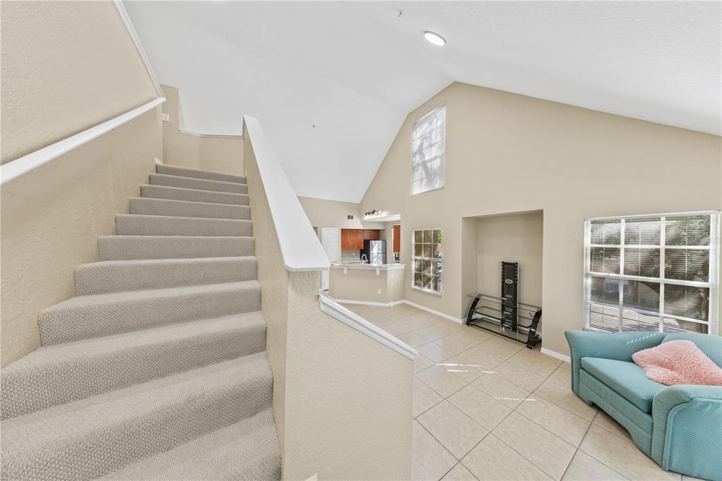 6340 Raleigh Street, Unit 1011 Orlando, FL 32835 - Photo 48 of 68 a view of a livingroom with furniture and staircase