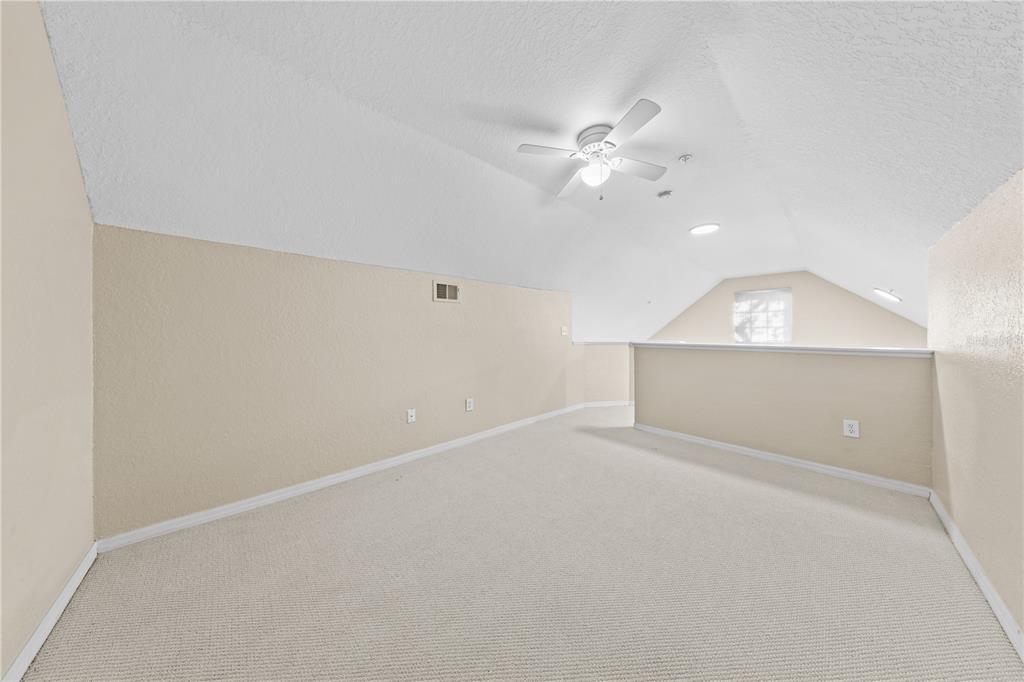 6340 Raleigh Street, Unit 1011 Orlando, FL 32835 - Photo 51 of 68 an empty room with fan and fan