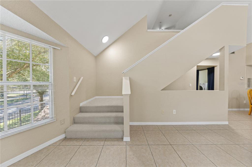 6340 Raleigh Street, Unit 1011 Orlando, FL 32835 - Photo 56 of 68 a view of entryway and hall with a window