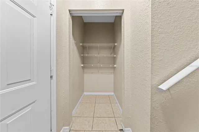 a living room with furniture and large windows