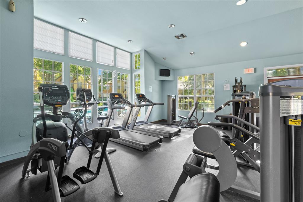 6340 Raleigh Street, Unit 1011 Orlando, FL 32835 - Photo 65 of 68 a view of a room with gym equipment