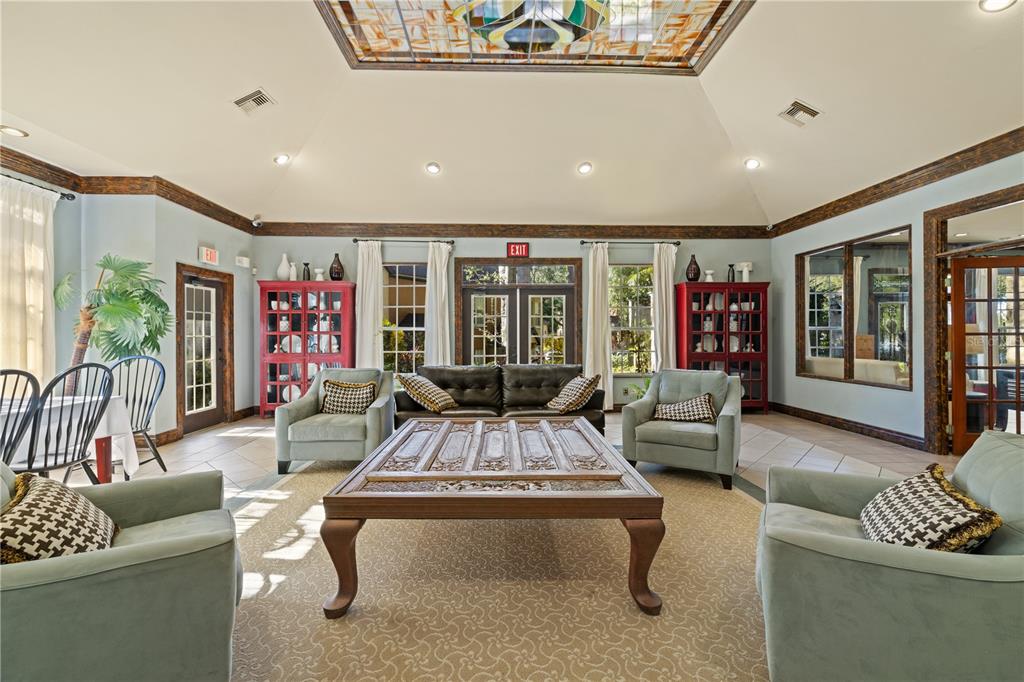 6340 Raleigh Street, Unit 1011 Orlando, FL 32835 - Photo 67 of 68 a living room with furniture and a large window