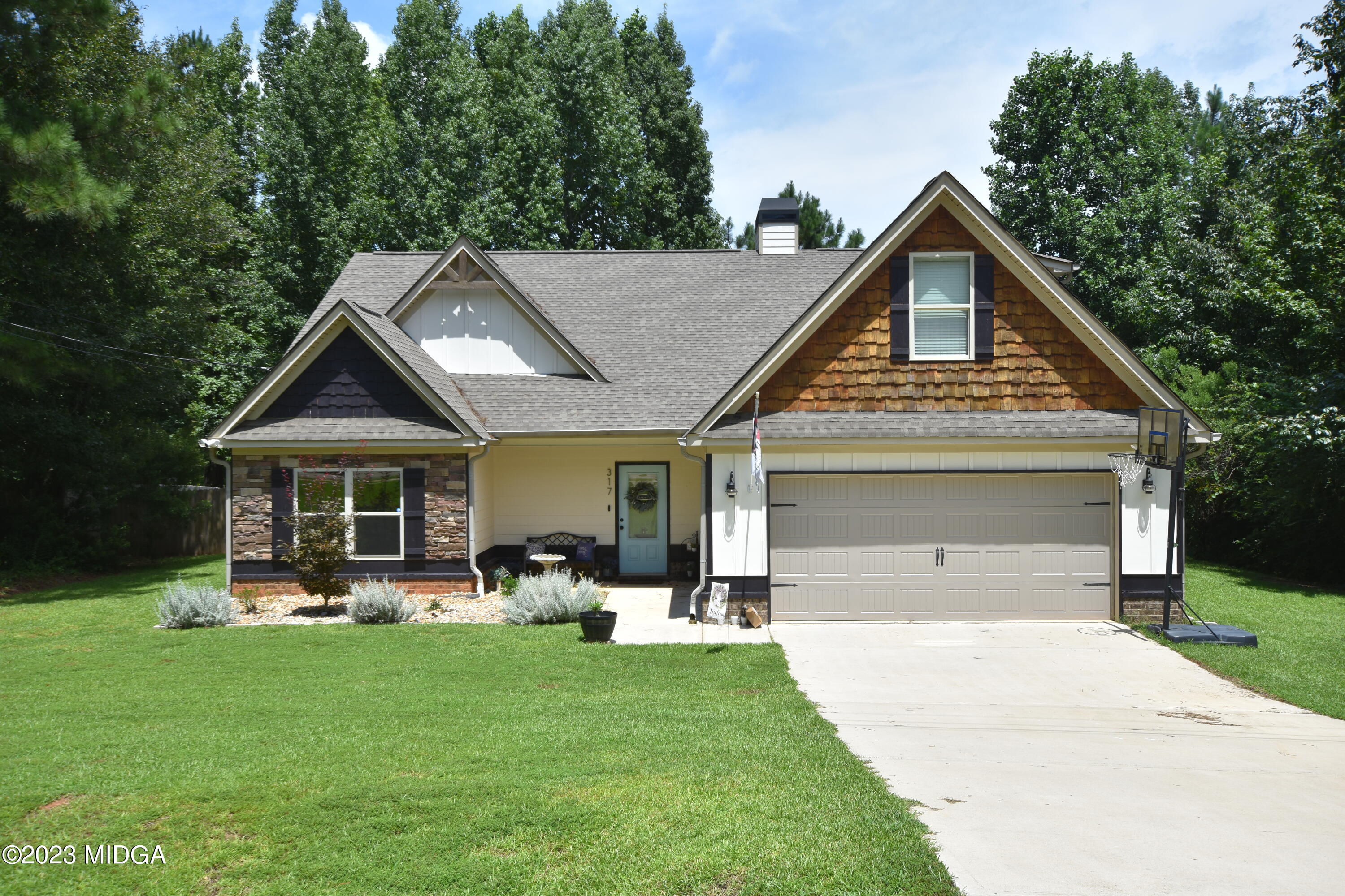 317 Walnut Grove Road Gray, GA 31032 - Photo 3 of 55 a front view of house with yard and green space