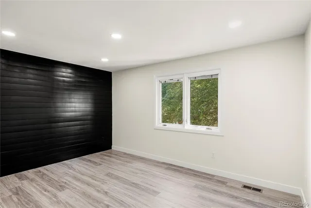 a room with a bed and a window