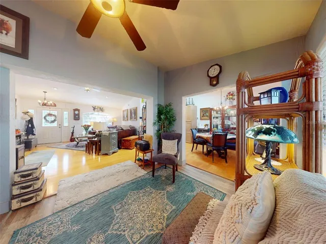 a view of a dining room with furniture and chandelier