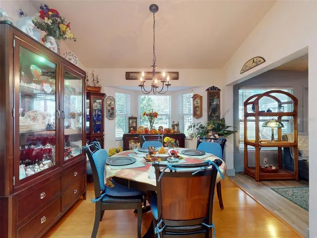 a kitchen with stainless steel appliances granite countertop a sink dishwasher stove refrigerator and cabinets