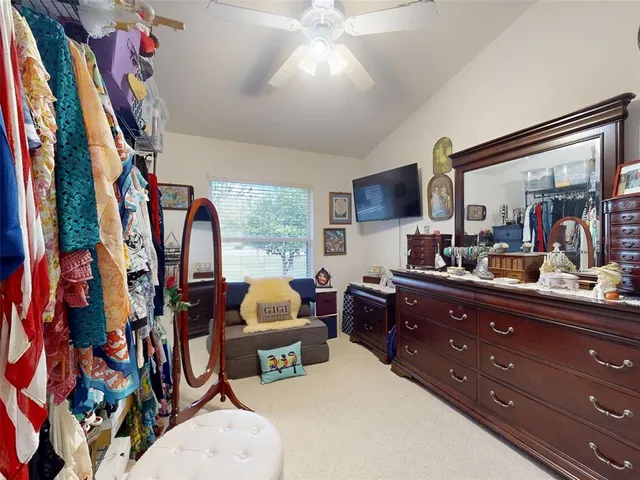 a bedroom with a bed and furniture