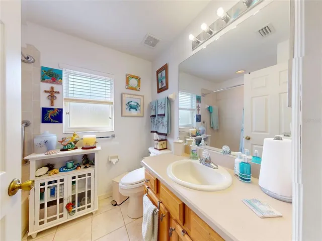 a bathroom with a sink double vanity granite and a mirror