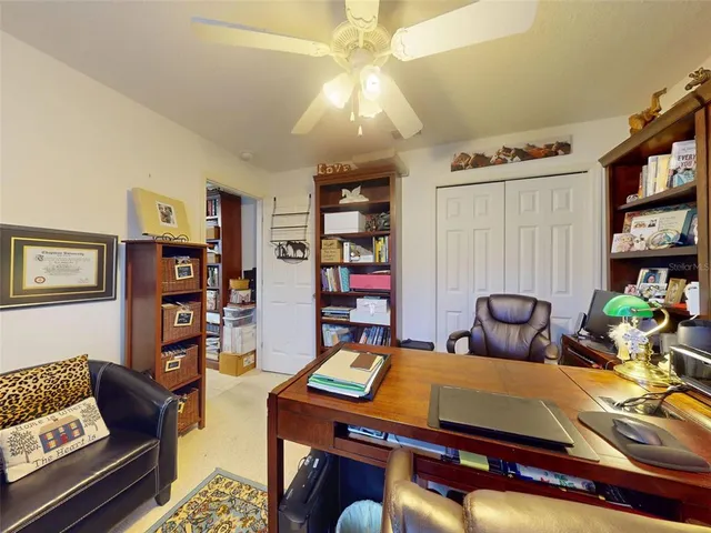 a view of a house with backyard porch and sitting area