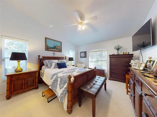 an aerial view of a house with garden space ocean and mountain view in back