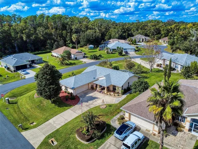 a front view of a house with outdoor seating