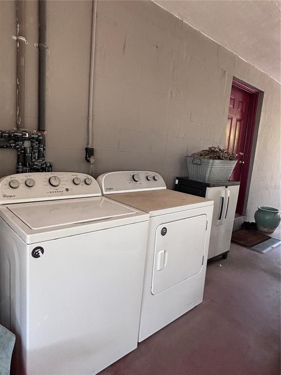 3137 Northwest 6th Street Gainesville, FL 32609 - Photo 9 of 11 a utility room with dryer and washer
