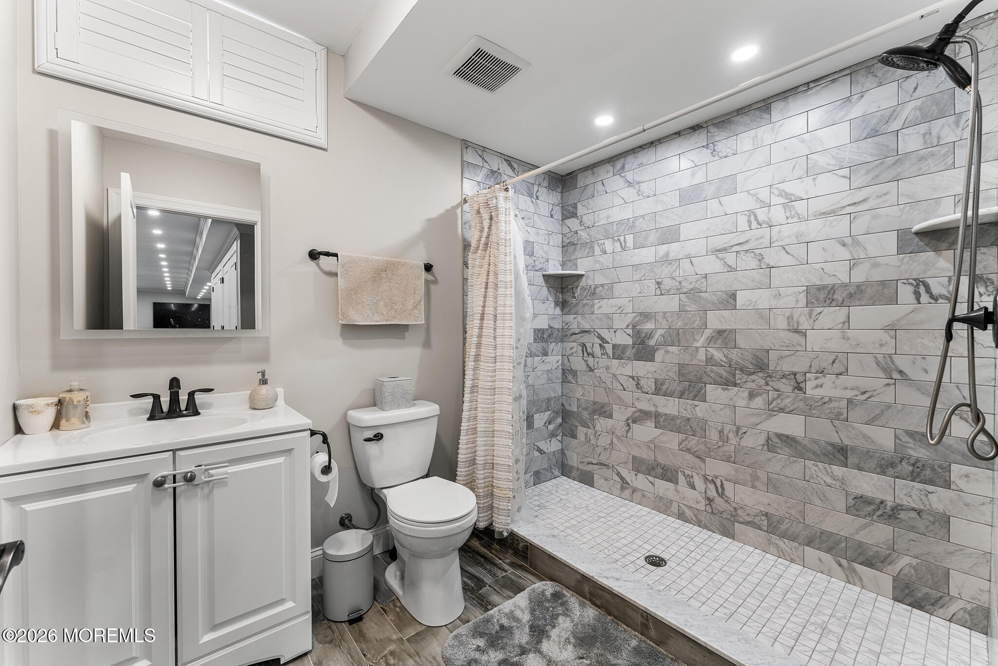 8 Cindy Court Howell, NJ 07731 - Photo 14 of 63 a bathroom with a toilet sink and shower